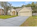 Curb appeal of a single story home with a large driveway at 16104 Stowe Ct, Tampa, FL 33647