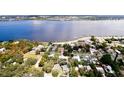 Wide aerial view showcasing a home's waterfront proximity and neighborhood setting at 1815 2Nd E Ave, Bradenton, FL 34208