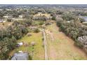 Wide shot of property showing home, large lot, and rural setting at 3009 Jim Johnson Rd, Plant City, FL 33566