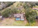 Aerial view showing home, pool, and surrounding property at 3009 Jim Johnson Rd, Plant City, FL 33566