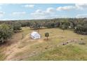 Aerial view of property with detached garage/workshop at 3009 Jim Johnson Rd, Plant City, FL 33566