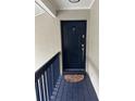 Condo building entryway with dark blue door and floral mat at 306 S Habana Ave # 7, Tampa, FL 33609