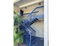 Exterior condo building staircase with blue railing at 306 S Habana Ave # 7, Tampa, FL 33609