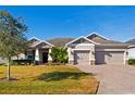 Two-story house with a two-car garage and manicured lawn at 5149 Jennings Trl, Brooksville, FL 34601