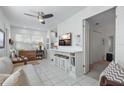 Bright living room with comfy seating and a TV at 5267 81St N St # 12, St Petersburg, FL 33709