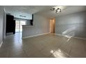 Open living room with view of kitchen and pool at 6985 82Nd N Ave, Pinellas Park, FL 33781