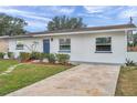 House exterior with walkway and landscaping at 9850 55Th N Way, Pinellas Park, FL 33782