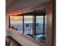 Mirror reflecting sunset over ocean from condo living area at 19440 Gulf Blvd # 301, Indian Rocks Beach, FL 33785