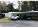 Covered carport parking with additional space for guest parking at 2060 Marilyn St # 103, Clearwater, FL 33765