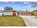 Attractive single story home with brick facade and landscaped yard at 2124 16Th Sw Ave, Largo, FL 33770