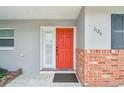 Inviting red front door entry to a newly remodeled home at 2124 16Th Sw Ave, Largo, FL 33770