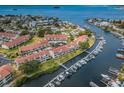 Aerial view of community with waterfront access and boat docks for residents at 2353 Hanover Dr, Dunedin, FL 34698
