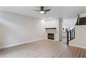 Living room with fireplace and laminate floors at 291 Winchester Way, Palm Harbor, FL 34684