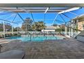 Inviting screened pool area with a large patio perfect for relaxation at 377 Jenico Ct, Spring Hill, FL 34609