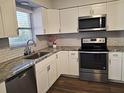 Modern kitchen with granite countertops and stainless steel appliances at 3843 19Th N Ave, St Petersburg, FL 33713