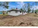 Side view of a newly renovated home, showcasing its clean lines and landscaping at 40242 Sunburst Dr, Dade City, FL 33525