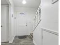 Bright entryway with staircase and wood-look floors at 5328 Ridgewell Ct, Tampa, FL 33624