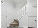 Simple white staircase with wood flooring at 5328 Ridgewell Ct, Tampa, FL 33624