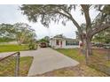 Cute bungalow home with carport and mature landscaping at 723 Ornelda Sw St, Ruskin, FL 33570
