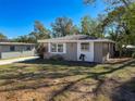 Well-maintained home with a large front yard and landscaping at 1116 E Boyer St, Tarpon Springs, FL 34689