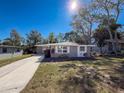 Nice curb appeal, freshly painted home with a spacious yard at 1116 E Boyer St, Tarpon Springs, FL 34689