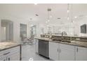 Open kitchen with island, stainless steel appliances, and granite counters at 15214 Octavia Ln, Odessa, FL 33556