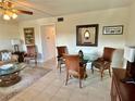 Living room with tiled floors, seating area, and dining table at 2042 Australia W Way # 78, Clearwater, FL 33763