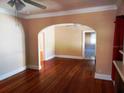 Bright living room with hardwood floors and arched entryway at 320 24Th N St, St Petersburg, FL 33713