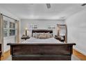 Main bedroom with sleigh bed and hardwood floors at 4307 W Kensington Ave, Tampa, FL 33629
