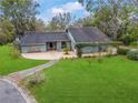 Single story home with a large backyard and mature trees at 4606 Ridgecliff Dr, Brandon, FL 33511