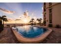 Inviting community pool area with sunset views at 4950 Gulf Blvd # 409, St Pete Beach, FL 33706