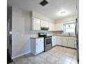 Updated kitchen with stainless steel appliances and tile flooring at 5311 20Th N Ave, St Petersburg, FL 33710