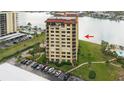 Aerial view of waterfront building, highlighting its location and amenities at 700 Island Way # 504, Clearwater, FL 33767