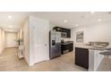 Modern kitchen featuring stainless steel appliances and granite countertops at 7812 Wheat Stone Dr, Zephyrhills, FL 33540