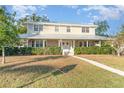 Two-story house with a wraparound porch and manicured lawn at 7312 7Th Nw Ave, Bradenton, FL 34209