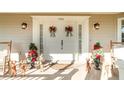 Elegant front door entrance with festive holiday decor at 7312 7Th Nw Ave, Bradenton, FL 34209