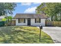 Recently renovated home with a spacious lawn and driveway at 10228 Oslin St, Tampa, FL 33615