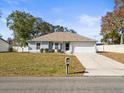 House with a driveway and a mailbox in front at 11013 Cranston St, Spring Hill, FL 34608