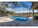 Relaxing screened-in pool with water views at 11919 Royce Waterford Cir, Tampa, FL 33626