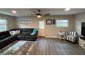 Living Room with sectional sofa, accent chair, and starfish rug at 12264 103Rd St, Largo, FL 33773