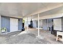 Covered patio with storage and a punching bag at 1434 Longwood Loop, Tampa, FL 33619