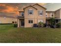 Townhome's backyard with a patio and grassy lawn at 17533 Stinchar Dr, Land O Lakes, FL 34638