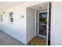 Condo entryway with glass door and mat at 340 Pinellas Bayway S # 306, Tierra Verde, FL 33715