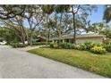 House exterior showcasing a well-maintained lawn and neighborhood view at 356 Grand Central Ave, Safety Harbor, FL 34695