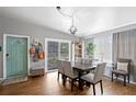 Bright dining area with a wooden table, view into living room and entryway at 4008 W North B St, Tampa, FL 33609