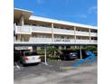 Exterior of building with assigned covered parking spots for residents at 4920 Locust Ne St # 203, St Petersburg, FL 33703