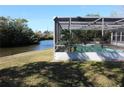 Screened pool area overlooking a canal at 5528 Berlin Dr, Port Richey, FL 34668