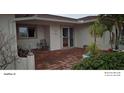 Inviting front entry with a brick paved patio and seating area at 8504 42Nd N Ave, St Petersburg, FL 33709