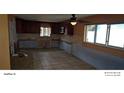 Kitchen with dark wood cabinets and tiled backsplash at 8504 42Nd N Ave, St Petersburg, FL 33709