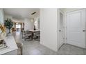 Bright entryway with view into dining area and kitchen at 9228 Forge Breeze Loop Loop, Wesley Chapel, FL 33545